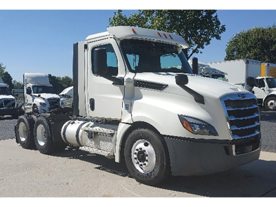 Freightliner Cascadia126 daycab tractor in white, side view showing cab and chassis