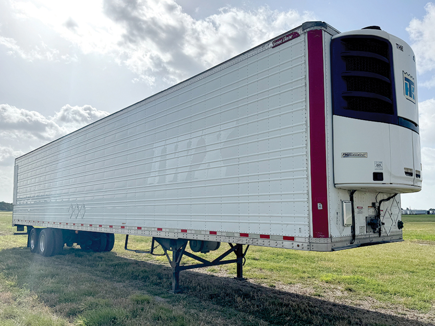 Trailer side view showing a Great Dane Everest SS reefer trailer with a white insulated body and a blue-front refrigeration unit.
