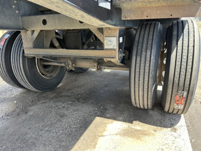 Rear view of a 2018 Jet Air Ride Side Dump trailer showing dual rear axles and suspension components.