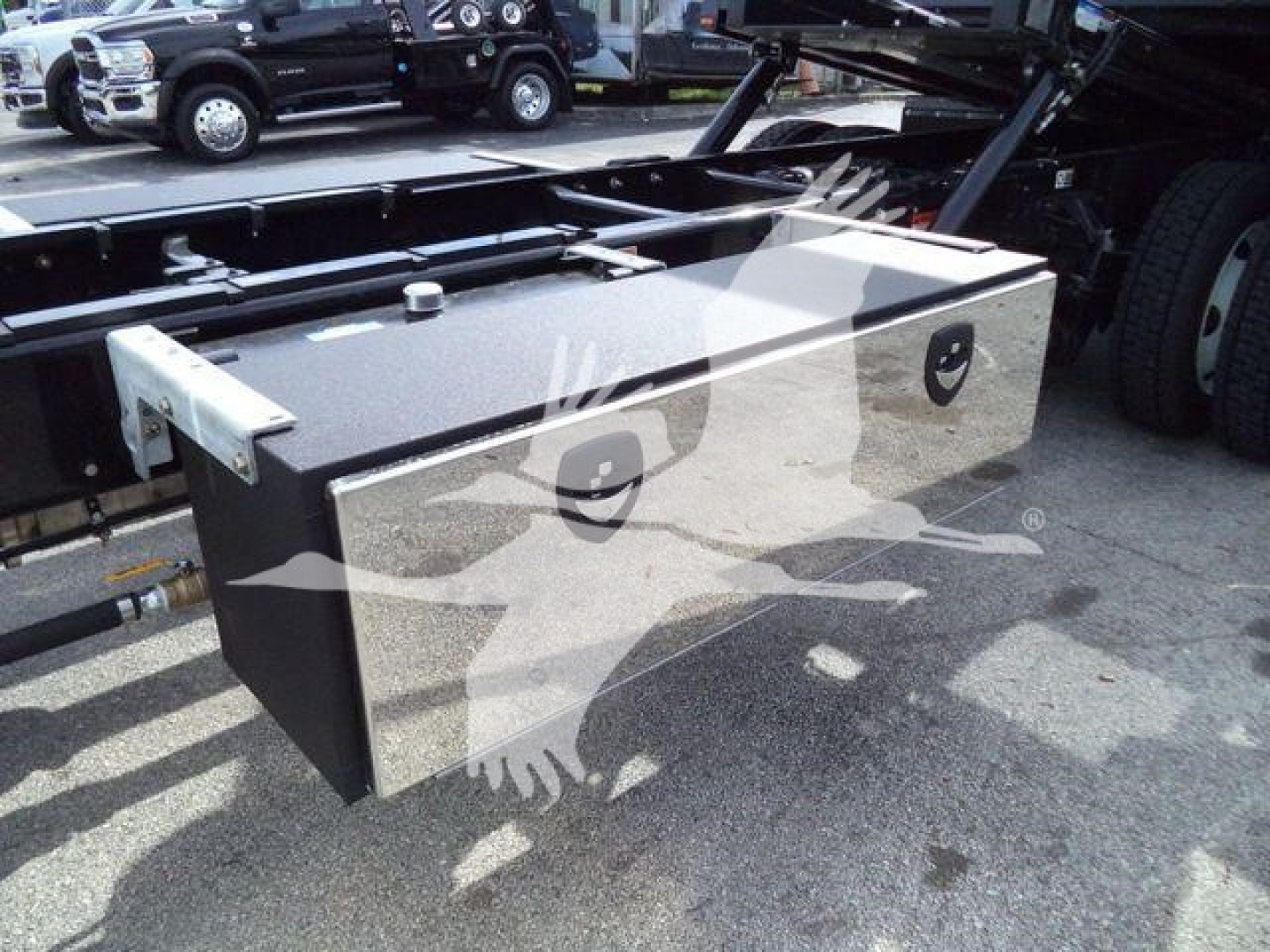 Kenworth T280 rollback truck fuel tank or toolbox mounted underframe showing rectangular aluminum toolbox with two circular lock handles.