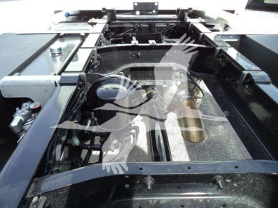 Kenworth T280 rollback chassis area showing frame rails and engine bay, with visible wiring and components.