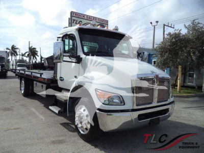 Kenworth T280 rollback truck in white with chrome grille and flatbed, front view showing cab and wheel, stock number WKWT280XLP22.