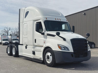 Freightliner Cascadia126 conventional sleeper tractor in white, front three-quarter view, with cab and sleeper aerodynamic fairing.