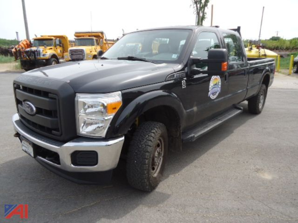 Ford F-350 Super Duty pickup truck with extended cab, black paint, front chrome bumper, badge on door, and crew cab, angled view showing front-left side.