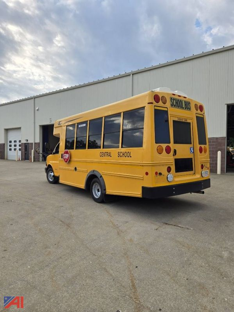 Yellow Chevrolet Express G4500 school bus rear and side view showing Central School District markings and school bus stop sign.
