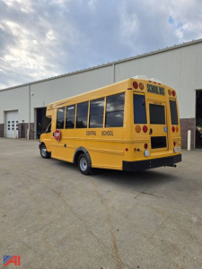 Yellow Chevrolet Express G4500 school bus rear and side view showing Central School District markings and school bus stop sign.