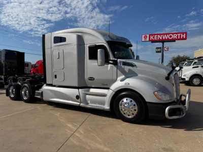 Kenworth T680 tractor in side view showing sleeper cab and chrome wheels