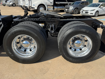 Kenworth T680 truck chassis dual rear wheels showing chrome wheels and tires.