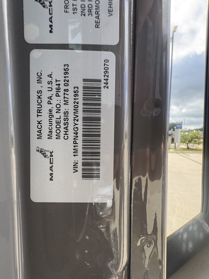 Label on Mack Trucks cargo area showing VIN 1M1PN4GY2VM021953 and stock number 73237 with model PI64T and Mack Trucks, Inc. branding.