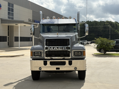 Front view of a brand-new 2027 Mack PI64T conventional daycab truck with chrome grille, large bumper, and dual stacked headlights.