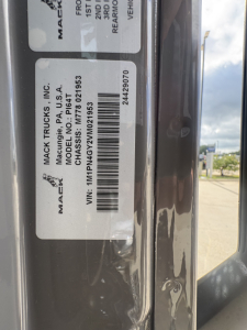 Label on Mack Trucks cargo area showing VIN 1M1PN4GY2VM021953 and stock number 73237 with model PI64T and Mack Trucks, Inc. branding.