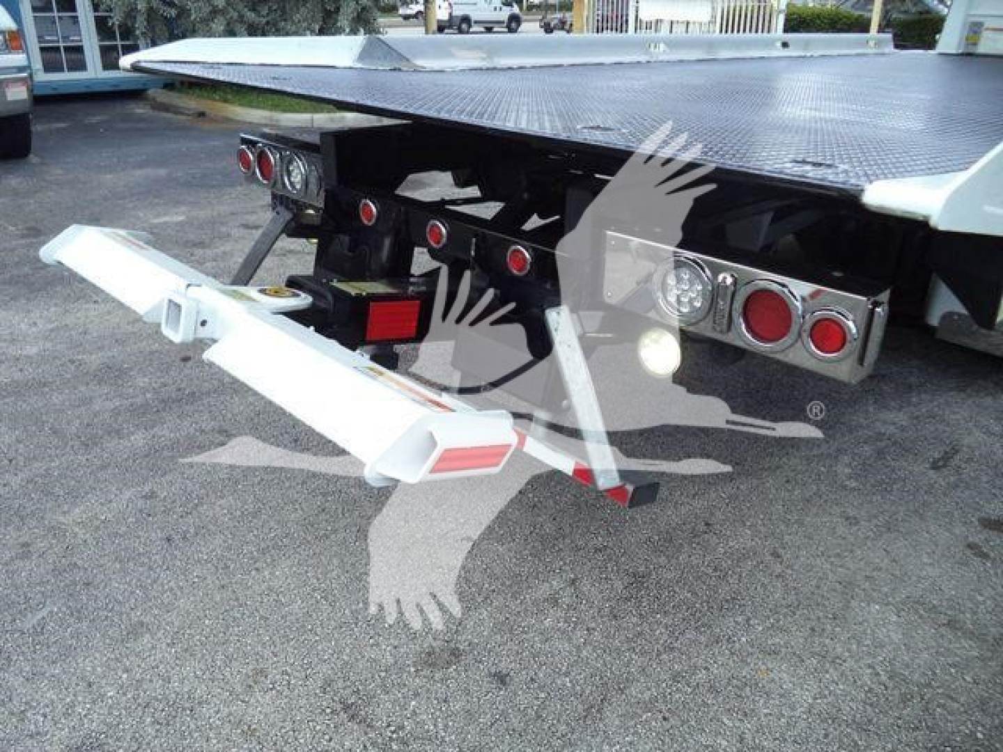 Peterbilt 337 rollback truck rear with folded aluminum ramp and taillights.