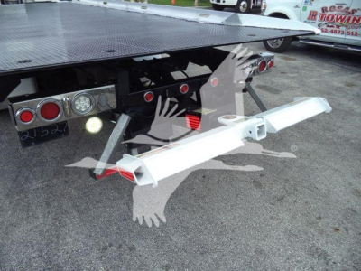 Peterbilt 337 rollback truck rear with flatbed and silver hitch, tail lights, and bumper; visible platform and chassis details