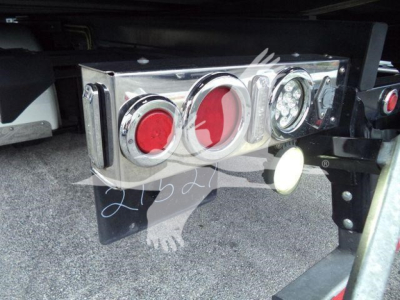 Peterbilt 337 rear/underneath showing chrome taillight bar with red and clear circular lenses and bumper hardware.