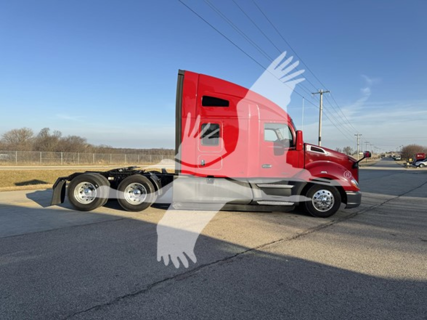 Kenworth T680 tractor in side profile view showing front and sleeper cab, red paint with chrome wheels and frame; visible windows and wheel arches.