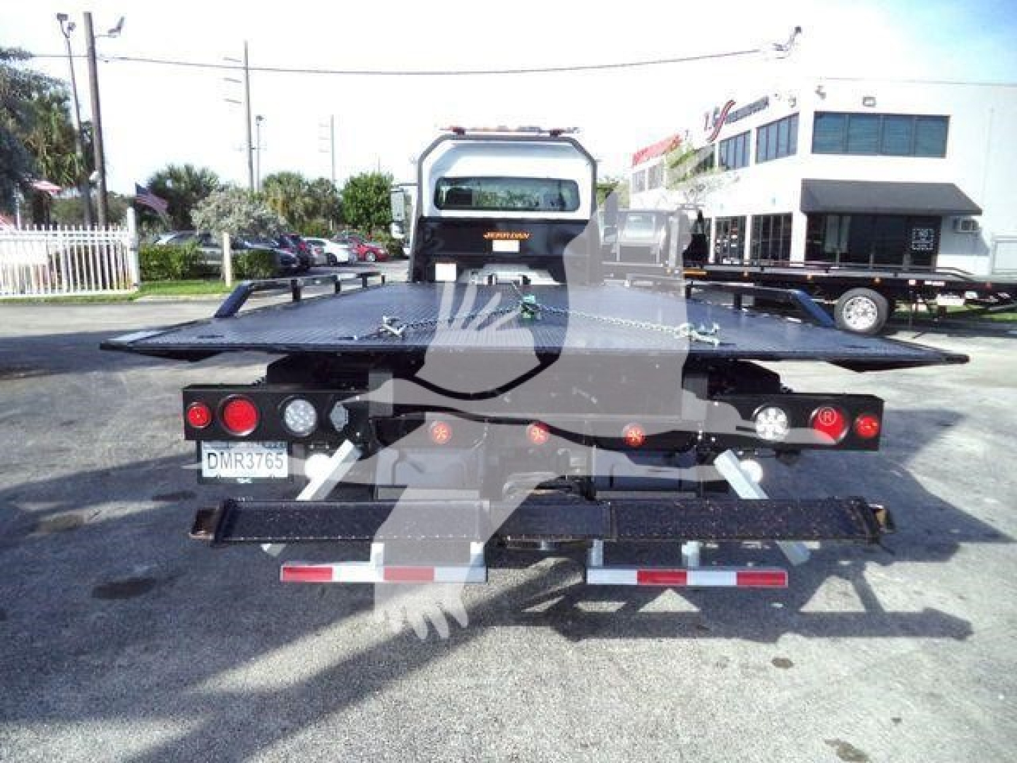 Flatbed tow truck bed rear with platform and lights, seen from back, Freightliner M2 106 Plus bow in worn area