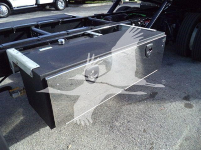 Diamond plated toolbox mounted on a Freightliner M2 chassis showing top surface with latches and access handle.
