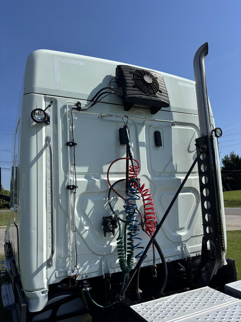 Truck cab back of Freightliner Cascadia 126 with air lines and electricals on white exterior