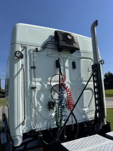 Truck cab back of Freightliner Cascadia 126 with air lines and electricals on white exterior