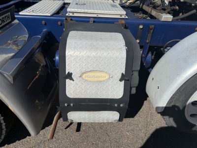 Kenworth T880 side toolbox with diamond plate cover and fuel line access, cab behind, blue chassis.