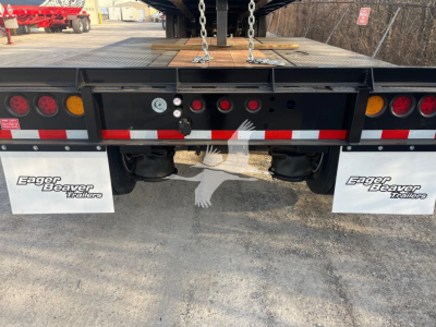 Eager Beaver 50Gsl-Pt lowboy trailer rear view showing taillights, mud flaps labeled Eager Beaver Trailers, and deck hooks.
