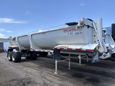 Dump trailer showing Ranco Ed26-34 markings, T-10 and ED26-34 model, with two-wheel tandem axle, stock UE11713 and VIN 150120344945 visible.