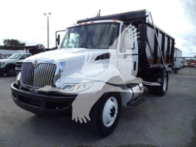 International Durastar 4300 dump truck in serviceable condition showing cab and dump bed with side steps and dual rear wheels.