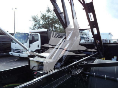 Truck bed view of a 2019 International Durastar 4300 with hydraulic crane/boom in the cargo area.