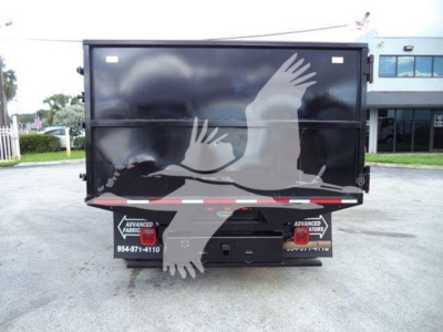 Rear view of a 2011 Ford E450 dump truck showing tailgate with graphic of flying birds and rear lights, stock number T10516, VIN 1FDXE4FS7BDA10516.