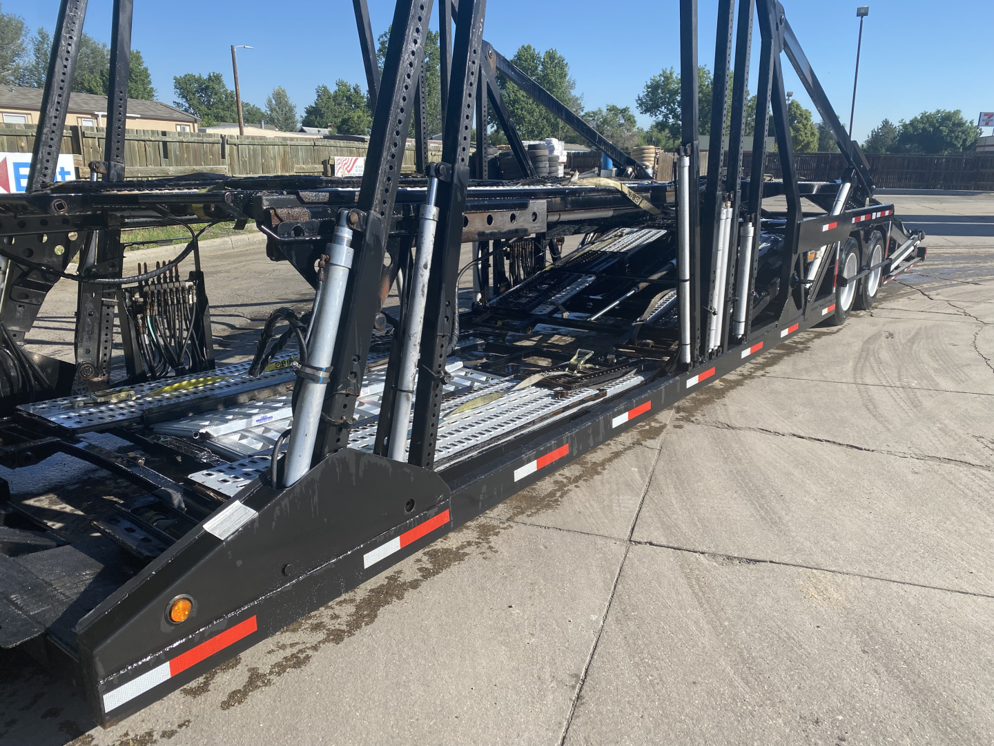 2019 Peterbilt 389 auto carrier trailer showing car transport equipment and loading ramps.
