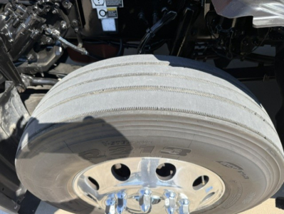 Kenworth T680 wheel hub and front tire with air brake drum visible.