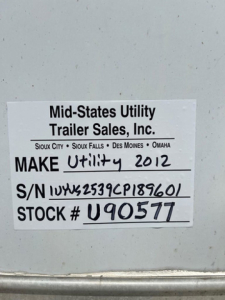 Plate on mid-states utility trailer showing Make Utility 2012, S/N 1UYVS2539CP189601, STOCK # U90577 from Mid-States Utility Trailer Sales, Inc.