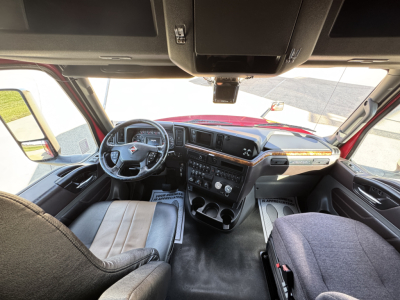 Interior cab of a 2018 International LT625 truck showing steering wheel, dashboard, and center console