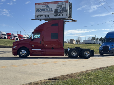 2018 International LT625 semi-truck tractor side view showing sleeper cab and five-wheel configuration