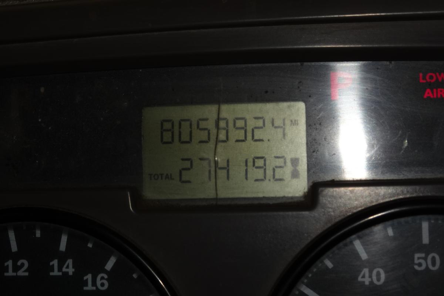 Dashboard display showing total miles 805,892.4 and total 271,419.2 on Mack CV Granite gauge cluster.