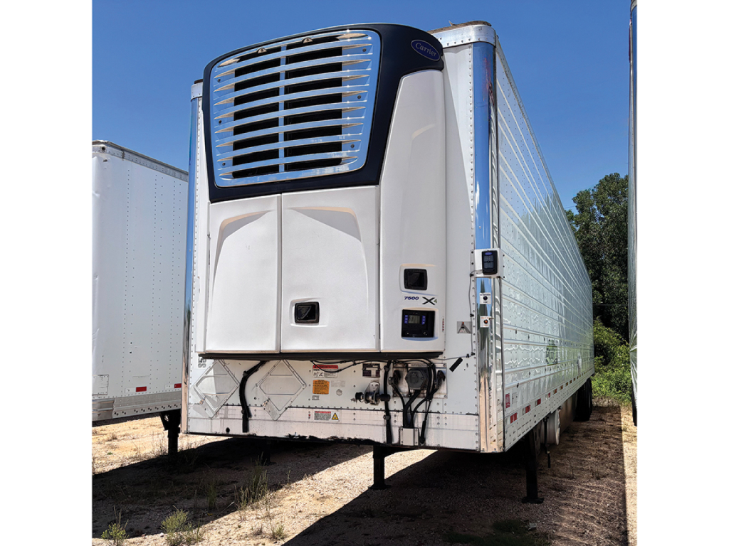 Trailer front view of a 2016 Utility 3000R refrigerated trailer with vertical refrigeration unit and landing legs.