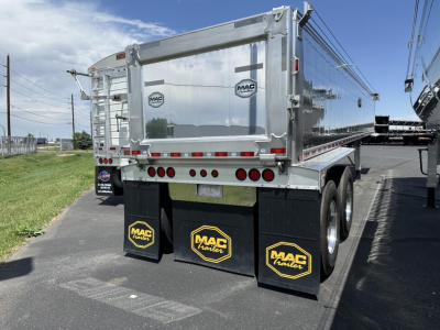 Mac trailer aluminum end dump with frameless design showing rear view and mudflaps with Mac Trailer logos