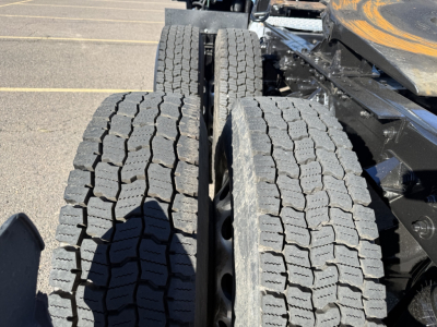 Kenworth T680 rear dual tires on trailer chassis with visible tread.