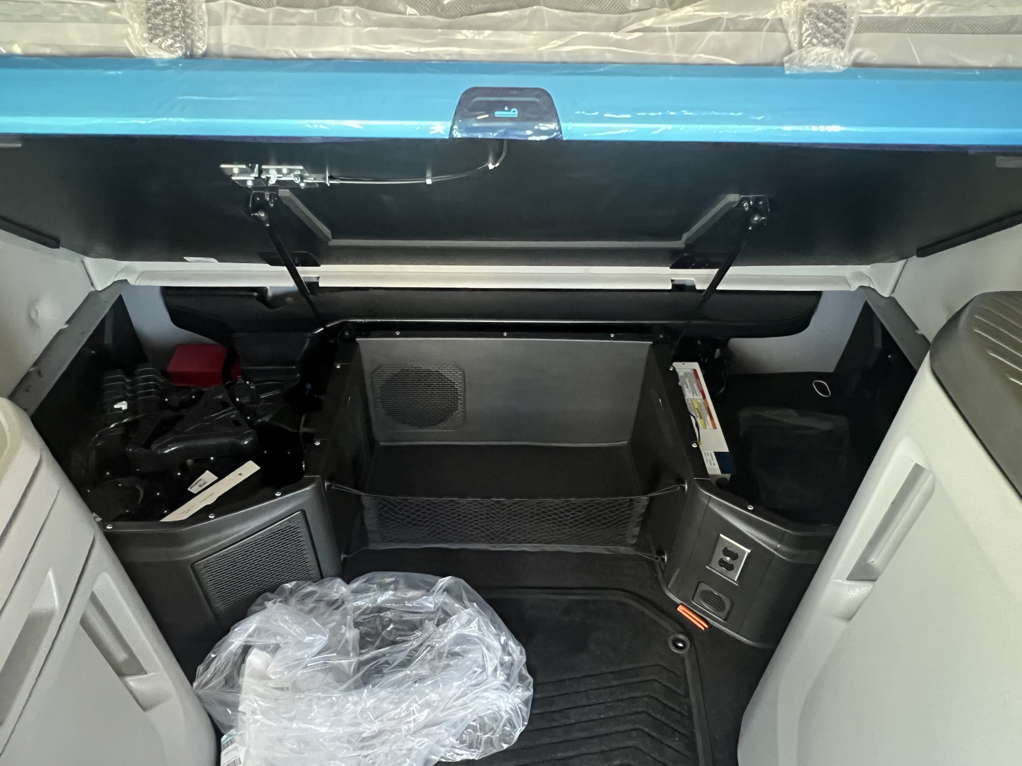 Volvo VNL64T860 sleeper cab interior showing control panel, storage compartments, and steps.