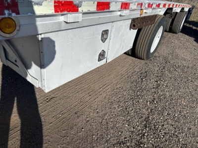 Trailer underside showing aluminum drop deck with dual rear axles and wheel fenders, part of a 2018 Reitnouer Maxmiser aluminum drop deck.
