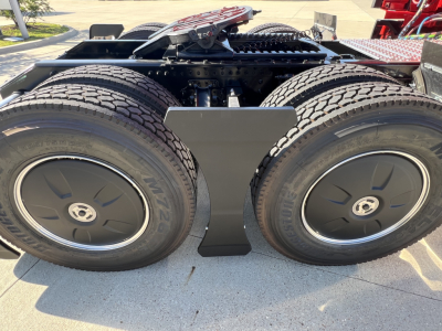 Volvo VNL sleeper truck rear dual rear axle with dual tires and central frame components visible.