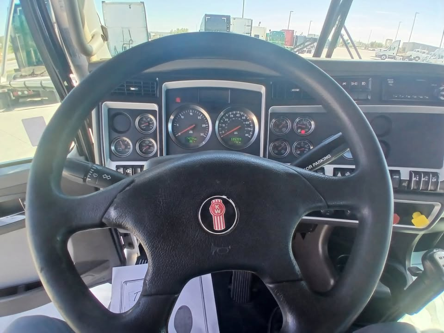 Kenworth T800 truck interior dashboard with steering wheel and instrument gauges visible.