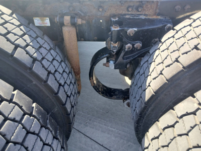 Kenworth T800 truck rear undercarriage showing dual rear tires, suspension components, and frame with electrical/air line routing.