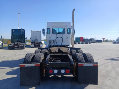 Kenworth T800 bunk sleeper tractor rear view showing fifth wheel, dual rear axles, dual rear mud flaps, and exhaust stack.