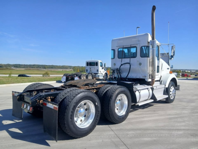 Kenworth T800 tractor showing side view with sleeper cab and dual rear axles.