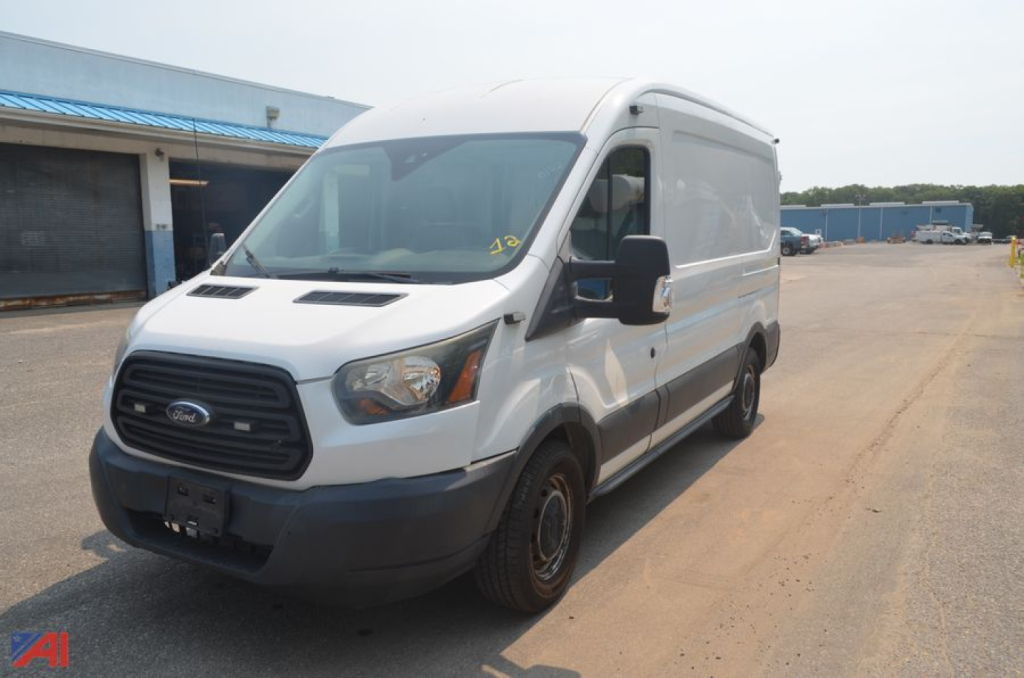 Ford Transit cargo van in a parking lot showing side and front; no visible labels or fluid reservoirs readable on exterior.