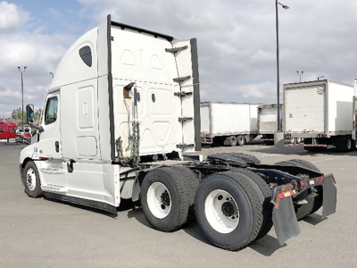 Freightliner Cascadia126 tractor-trailer cab and attached rear axle viewed from side showing sleeper cab and tandem axles.