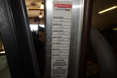 Kenworth T660 truck door jamb label showing truck model, chassis number, engine model, main transmission, auxiliary transmission, rear axle, and axle ratio information.