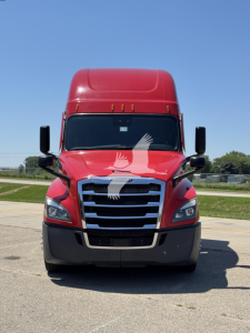 Front view of a red Freightliner Cascadia 126 sleeper tractor with black bumper and chrome grille.