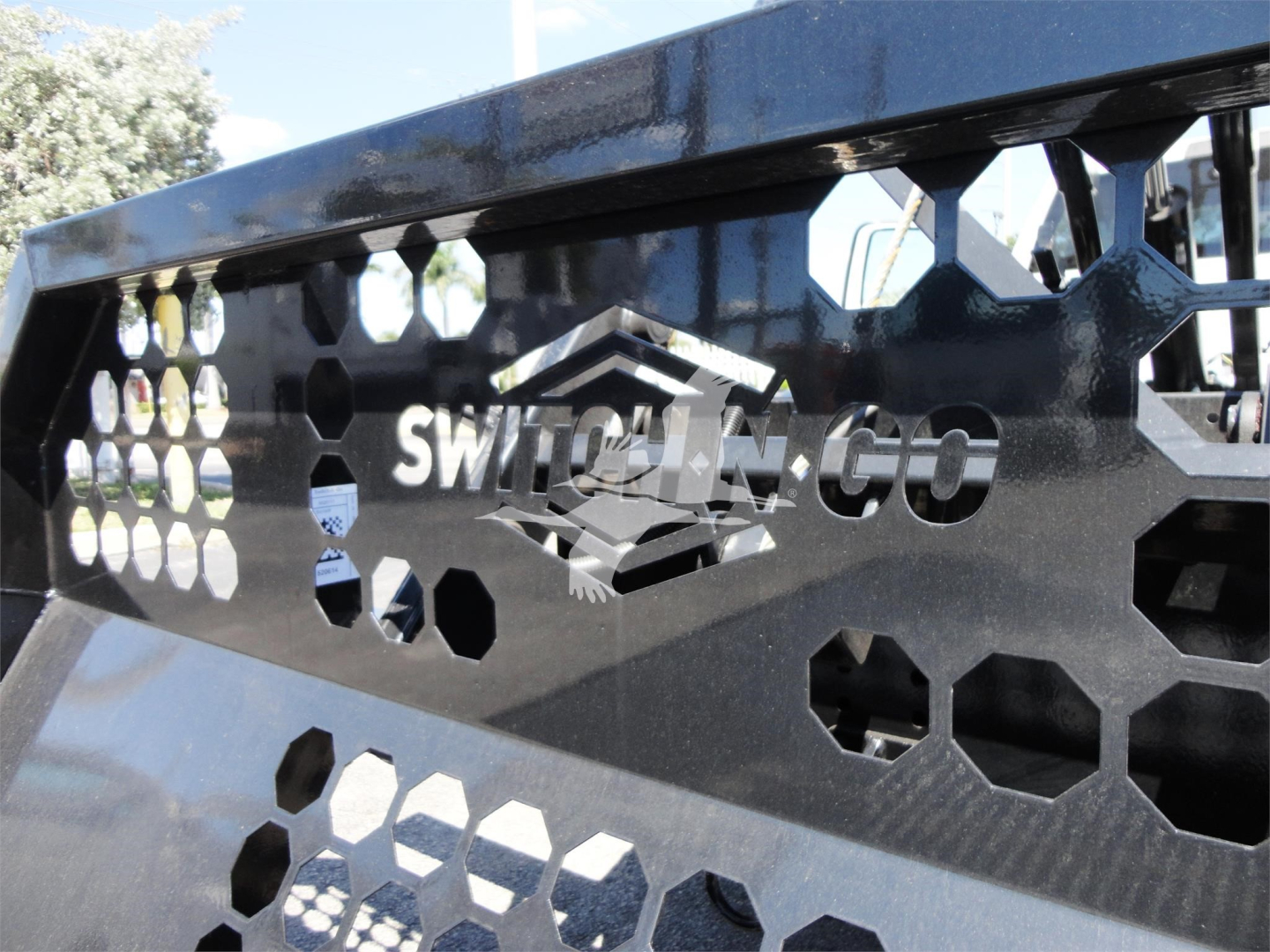 Ram 5500 truck front grill with Switch-N-Go logo and honeycomb pattern, metal components visible.
